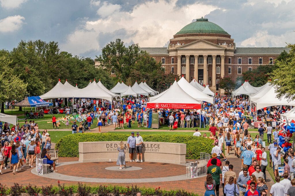 Image of the main quad in front of Dallas Hall enjoying tailgating activities.