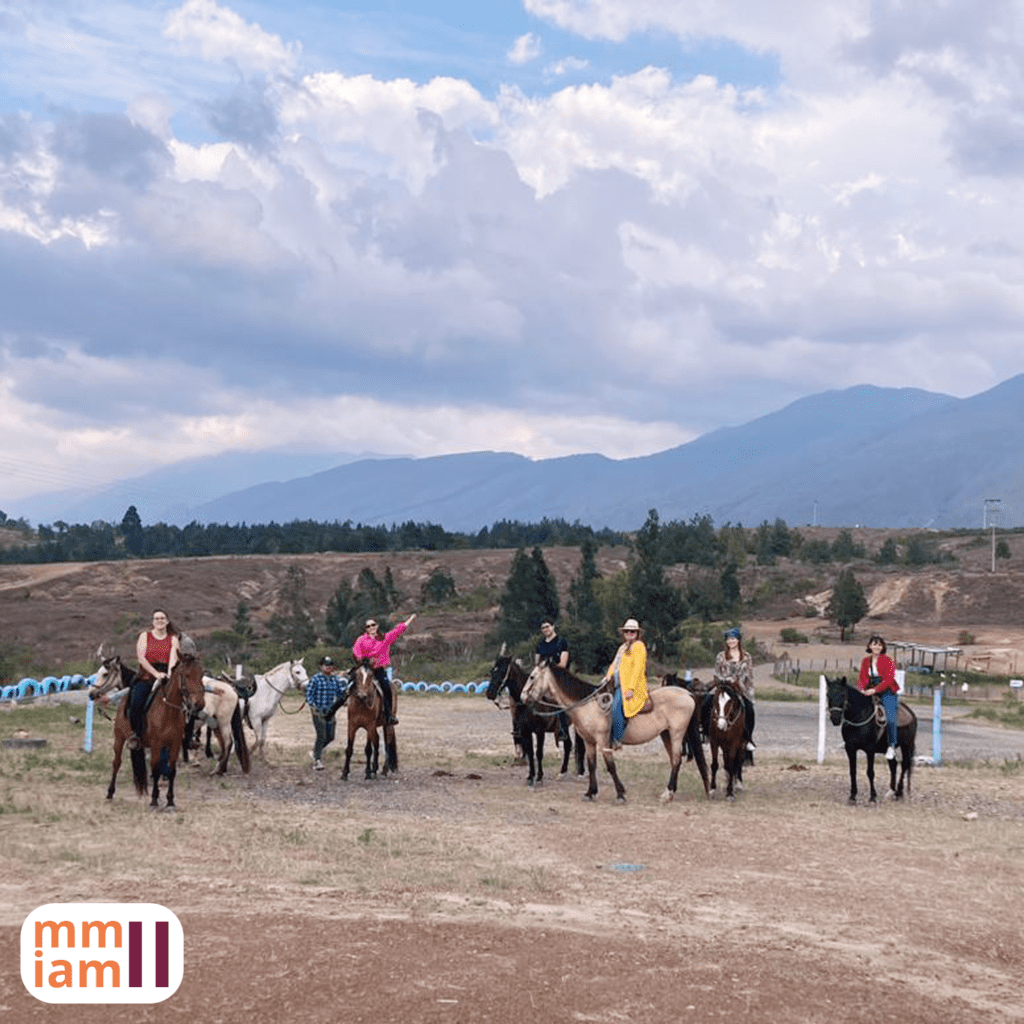 Students riding on horseback.