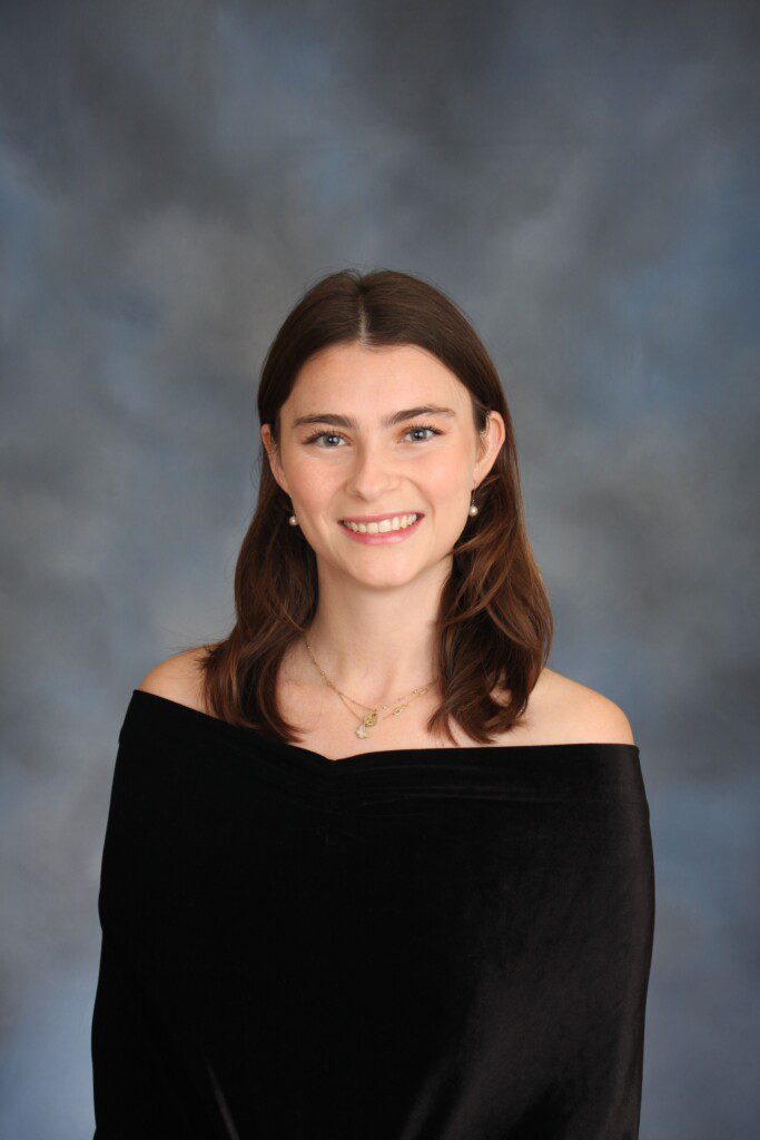 Image is a professional headshot of Mollie Essner in a black top.