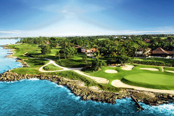 Image is of plush greenery on the coast of a resort.