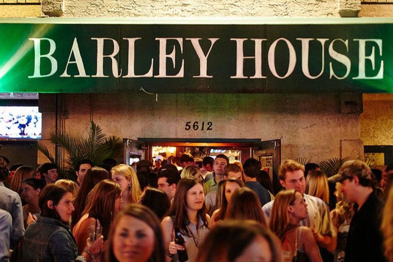 Entrance of the Barley House with a large crowd gathered