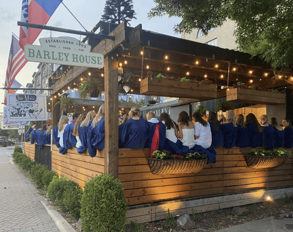 SMU students gathered in Barley House patio day of graduation

