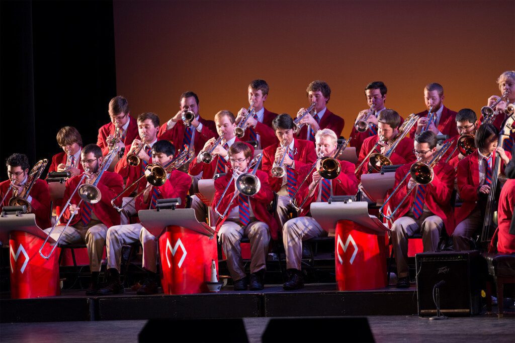 SMU band performing in red outfits. 